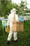 Beekeeper in protective suit