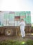 Beekeeper Standing Against Truck Loaded With