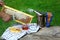 Beekeeper uncapping honeycomb with special beekeeping fork. chimney beekeeper. outdoors. Beekeeping concept