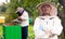 Beekeeper working in the apiary. Beekeeping concept. Beekeeper harvesting honey