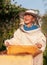 Beekeeper a young boy who works in the apiary. Beekeeping.