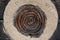 Beekeeping in past - Entrance to a taditional beehive made of braided straw in a bee house