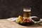 Beer and appetizing beer snacks set. Table with mug beer grilled