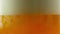 Beer being poured into translucent glass