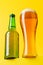 Beer bliss: Refreshing brew against a vibrant yellow backdrop