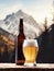 Beer bottle elegantly placed on a flat rock against the breathtaking backdrop of majestic mountains.