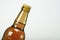 The beer bottle on a gray background is closed. Low alcohol drinks