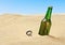 Beer bottle in the sand