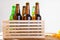 Beer bottles in wooden box. corrugated golden chips. Top view. Selective focus. Mock up. Copy space.Template. Blank.