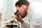 Beer Brewer in food laboratory examining