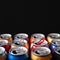 Beer cans. Close-up of multicolored aluminum cans. Many open empty cans. Recycling and reuse. Copy space. Selective  focus