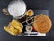 Beer chips burger sauces cutlery plate drink tasty
