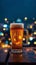 Beer delight glass on wooden table, vibrant city lights backdrop