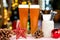 Beer drink glasses, mugs with christmas decorations with bokeh background