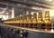 Beer factory conveyor with brown glass bottles on modern production line.Macro.AI Generative