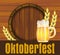 Beer festival Oktoberfest in Germany poster with with fresh lager beer and barrel on wooden plank. Vector