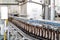 Beer filling in a brewery - conveyor belt with glass bottles