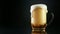 Beer foam overflowing from glass pint