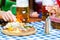 Beer garden - friends with beer and snacks in bavaria