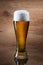 Beer. Gass of beer on wooden background