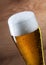 Beer. Gass of beer on wooden background