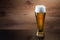 Beer. Gass of beer on wooden background with copyspace