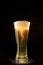 Beer glass with bubbles whirl