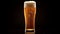 Beer glass filled with lager, with white head and slight glow behind, against neutral background