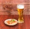 Beer glass with lager beer and sandwiches with salted trout