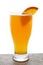 Beer in glass with orange