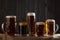 Beer glasses with lager, dark lager, brown ale