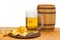 Beer in the grocery store with chips and barrel on white isolated background.