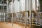 Beer manufacture line. Equipment for staged production bottling of Finished food products. Metal structures, pipes and tanks at en