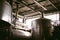 Beer manufacture line. Equipment for staged production bottling of Finished food products. Metal structures, pipes and tanks at en