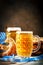 Beer mugs and pretzels on a wooden table. Oktoberfest. Beer festival.