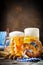 Beer mugs and pretzels on a wooden table. Oktoberfest. Beer festival.