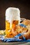 Beer mugs and pretzels on a wooden table. Oktoberfest. Beer festival.