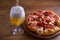 Beer and pizza. Glass of beer. Ale and appetizer snack