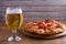 Beer and pizza. Glass of beer. Ale and appetizer snack