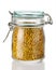 A beer pollen in a glass jar is on a white background. Beekeeping products. Apitherapy.