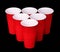 Beer pong. Red plastic cups over black