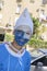 Beer-Sheva Negev, Israel - March 24,Portrait of a teenager with a blue make-up in a white cap, Purim