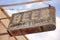 A beer sign marks the location of a long abandoned bar.