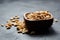 beer snack, wooden bowl with roasted peeled peanuts