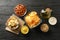 Beer snacks, potato chips, beer nuts, sauces, olive oil on wooden background, space for text