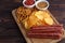 Beer snacks set.Close up of wooden board with salami, chips and