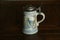 Beer stein with fish painted on side