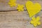 Beeswax, heart and flowers on wooden table