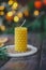 Beeswax spruce shaped candles on dark background