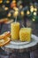 Beeswax spruce shaped candles on dark background